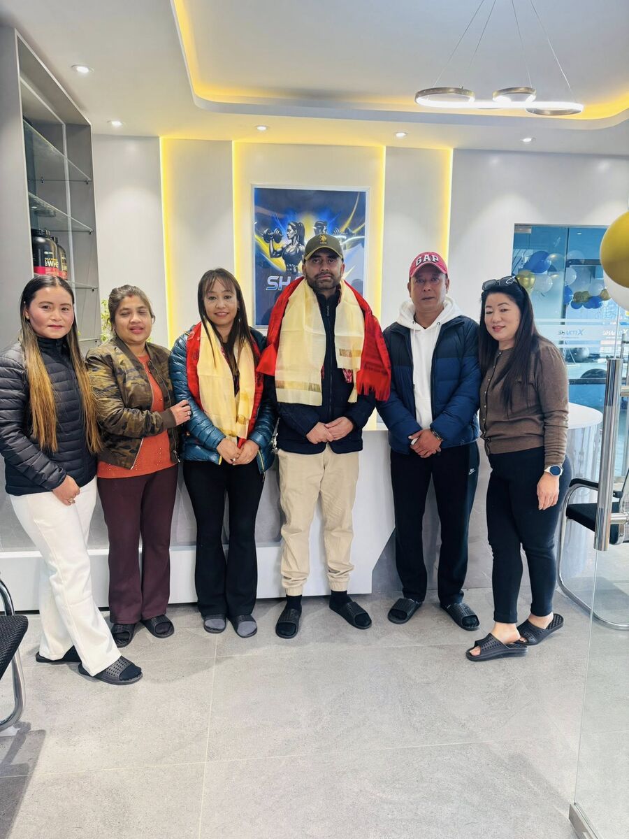 Owners and guests gathered at the gym opening blessing ceremony
