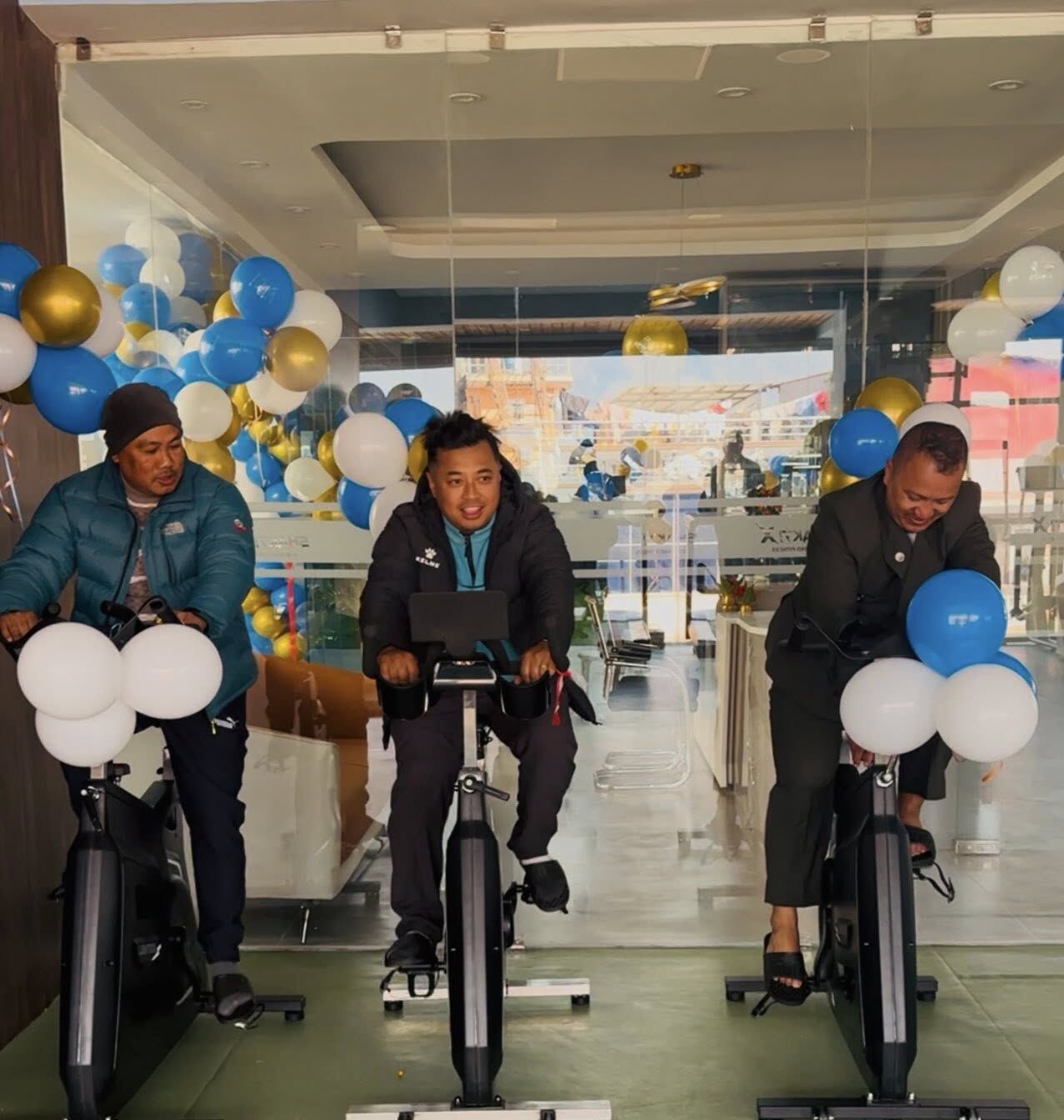 Spin studio at Shakti X with three indoor cycling bikes lined up